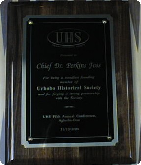 A plaque of recognition presented to Chief Dr. Perkins Foss